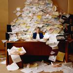 woman with piles of paper