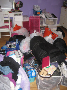 Messy bedroom with things they brought home from college