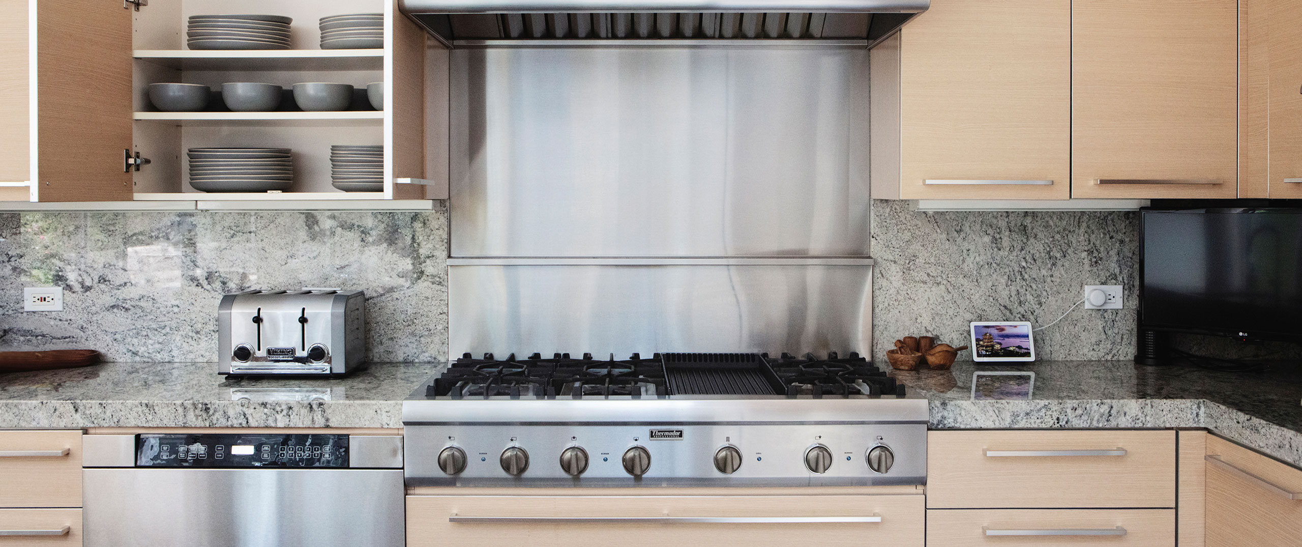 A clean modern kitchen with stainless steel appliances